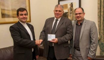 Vicenzo Caruana Spiteri CD presented to the Minister for Gozo