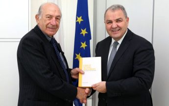 Speaker presented with the book `A Man of Cultural Achievements’