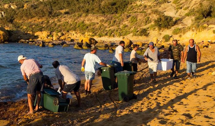 Algae cleared away from along the shoreline at Ramla Bay Gozo