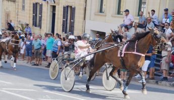 Large crowds line Republic Street for Santa Marija horse races