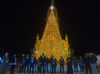 Unique 62ft Christmas Tree of glass bottles lit up in Ghajnsielem