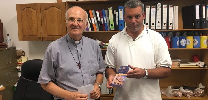 Archbishop Mgr. Alfred Xuereb presents donation to Dar Arka