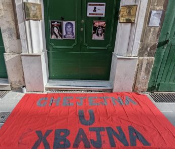 Moviment Graffitti activists stick placards at Home Affairs Ministry