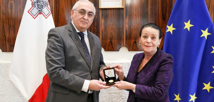 President presented with coin commemorating 50th anniversary of the Republic
